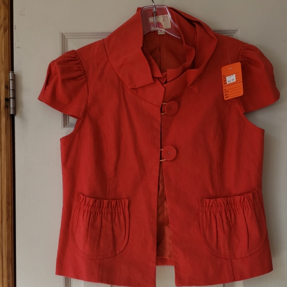 Full lined short sleeve orange button down shirt.